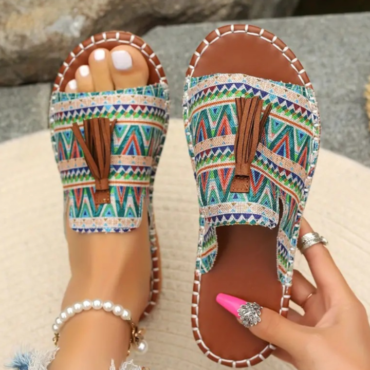 Green boho print flat slide sandals with suede tassel detail