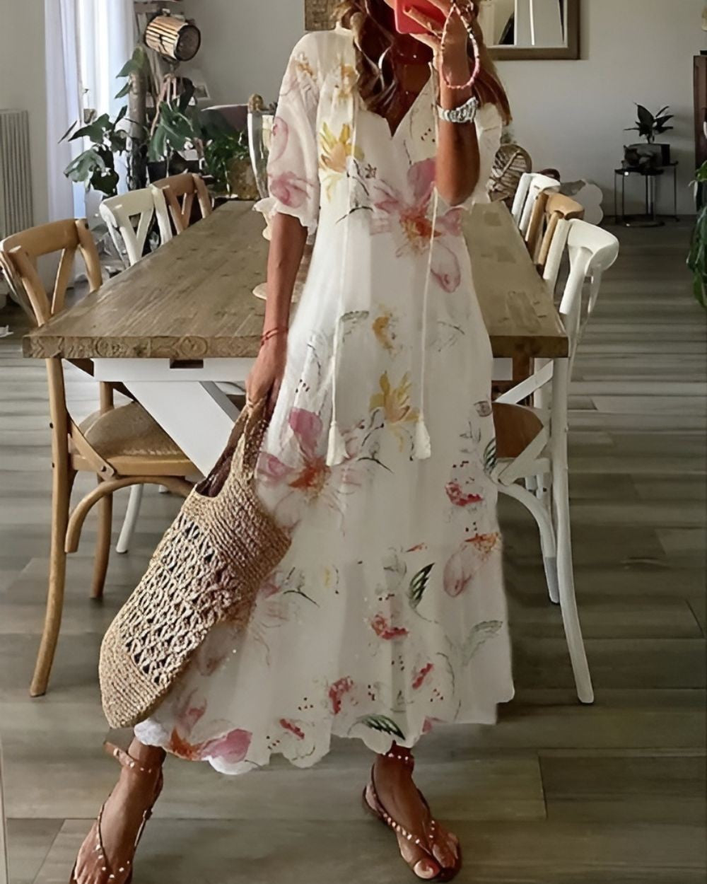 white floral print maxi dress with tasseled V-neckline
