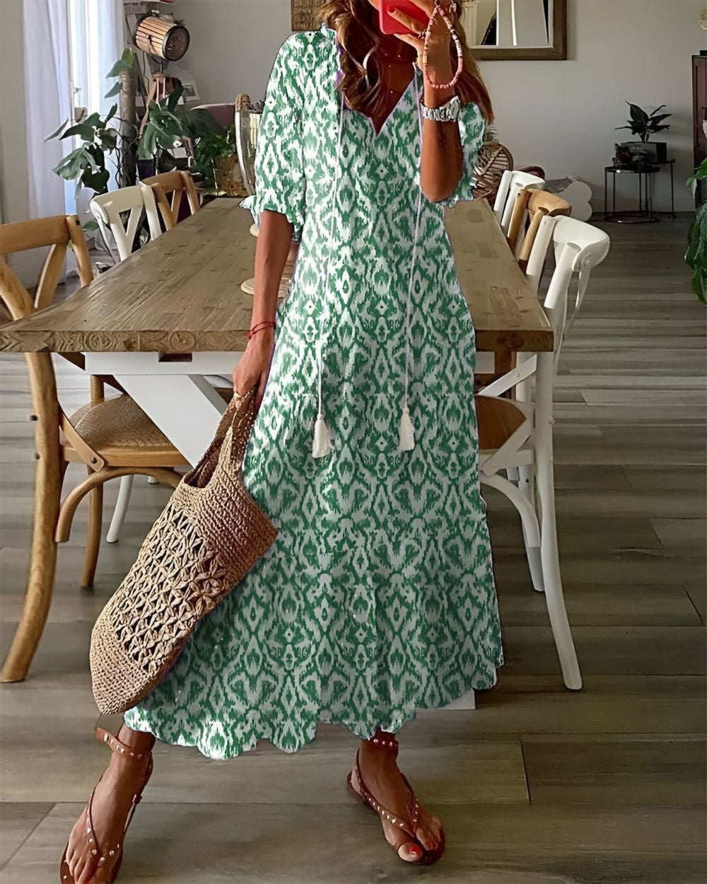 Green ikat print boho maxi dress featuring tasselled neckline and half sleeves