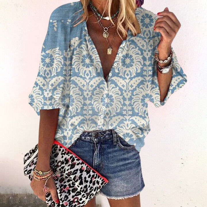 light blue paisley print blouse with V-neck and long sleeves