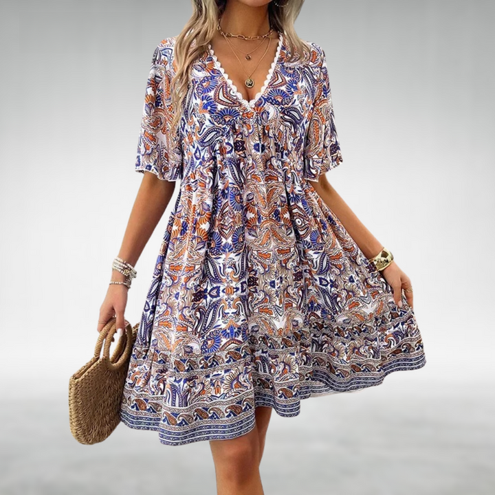 Navy and orange paisley print boho dress with crochet V-neck trim