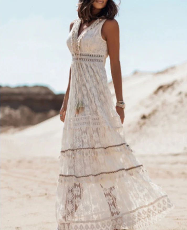Sleeveless white lace maxi dress featuring crochet trim and flowy A-line skirt