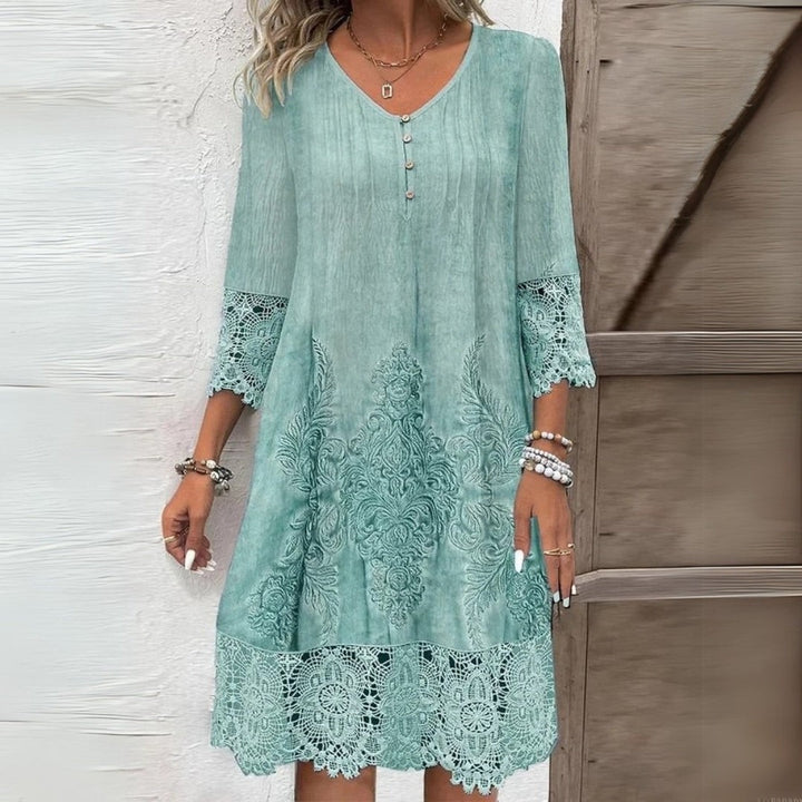 Mint green boho midi dress featuring crochet lace trim and floral embroidery