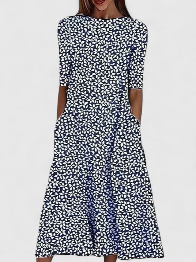 Navy midi dress with white geometric floral print, back view