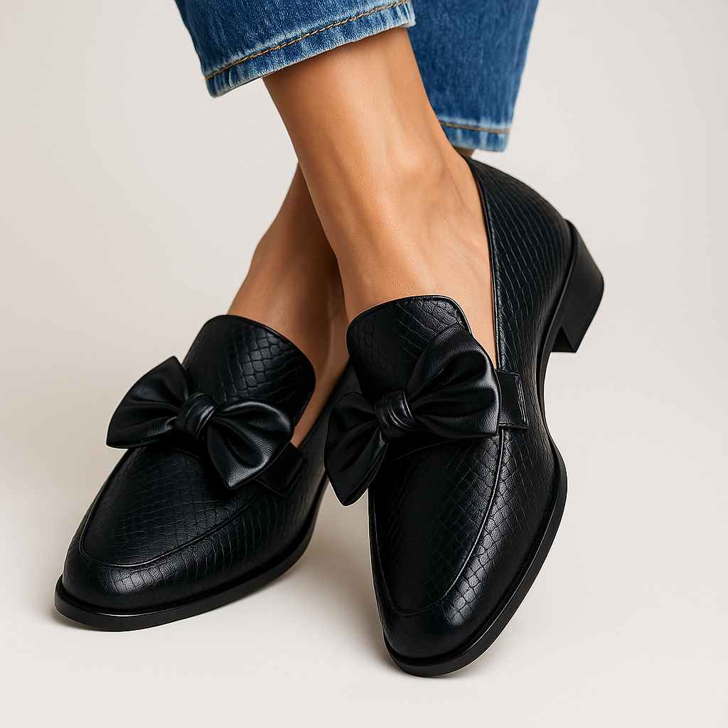 Black textured leather loafers with bow detail and low block heel