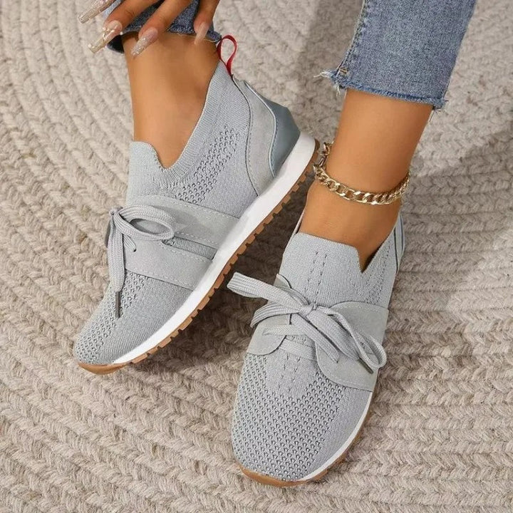 gray knit slip-on sneakers with bow accent and rubber outsole
