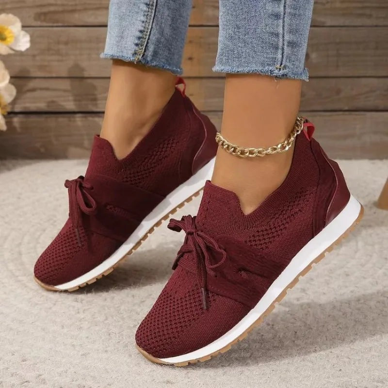 burgundy knit sneakers with bow tie front and white cushioned sole