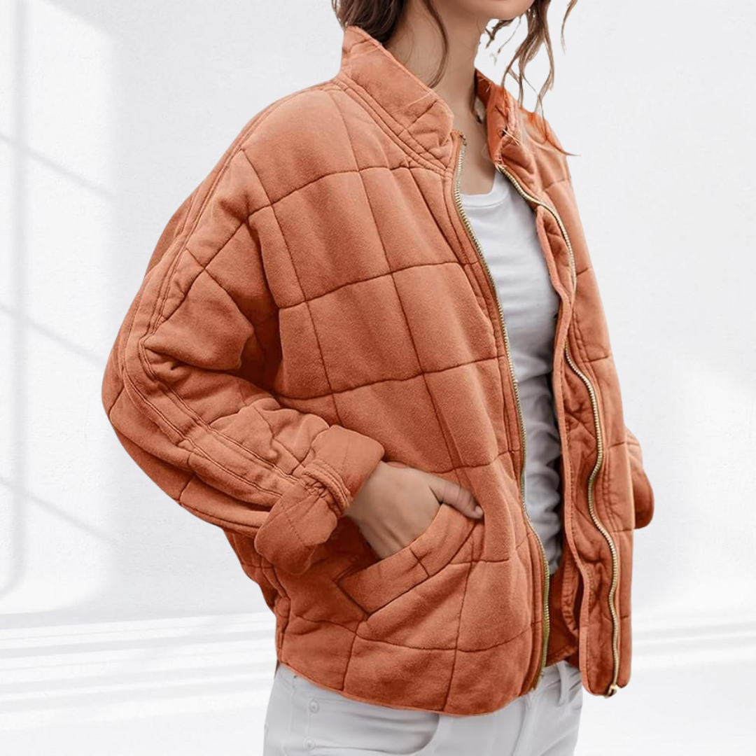 Rust orange quilted puffer jacket with stand collar and gold zip closure