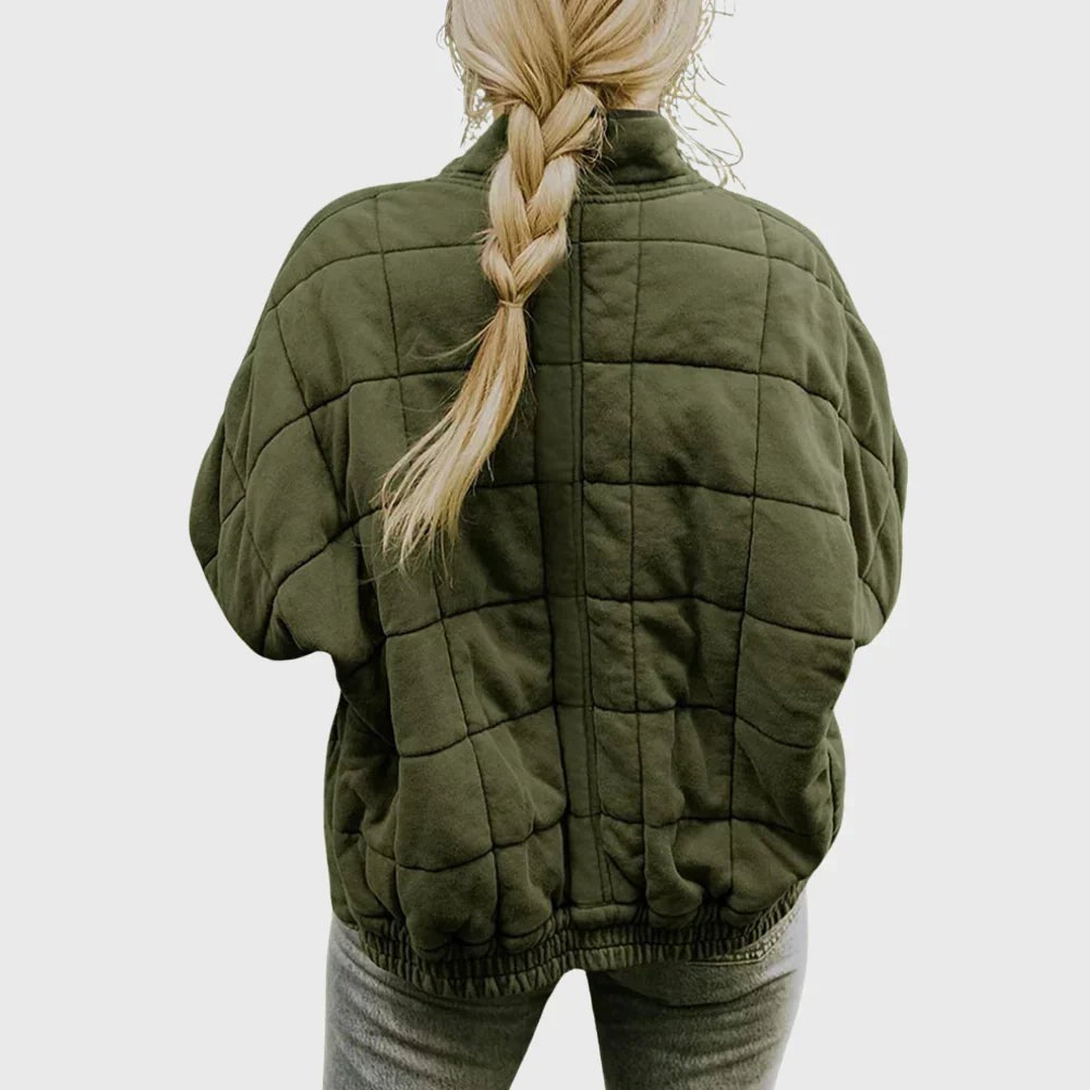 Rear view of khaki quilted puffer jacket showing boxy fit and ribbed hem