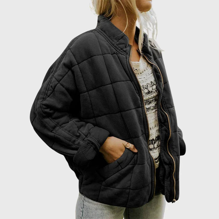 Black quilted puffer jacket with stand collar and gold-tone zip fastening