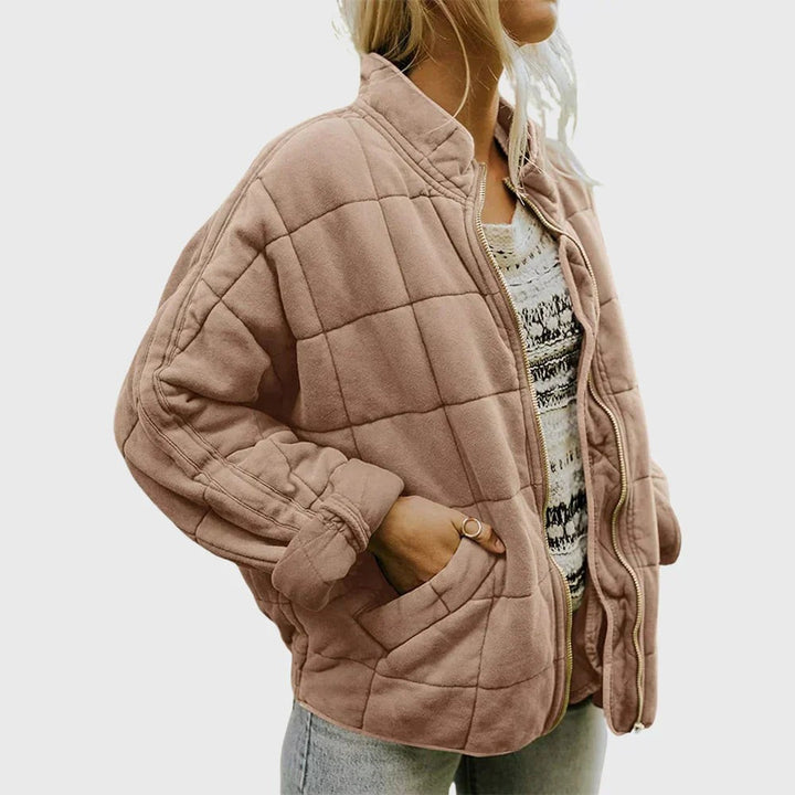 Dusty pink quilted puffer jacket with relaxed sleeves and stand collar