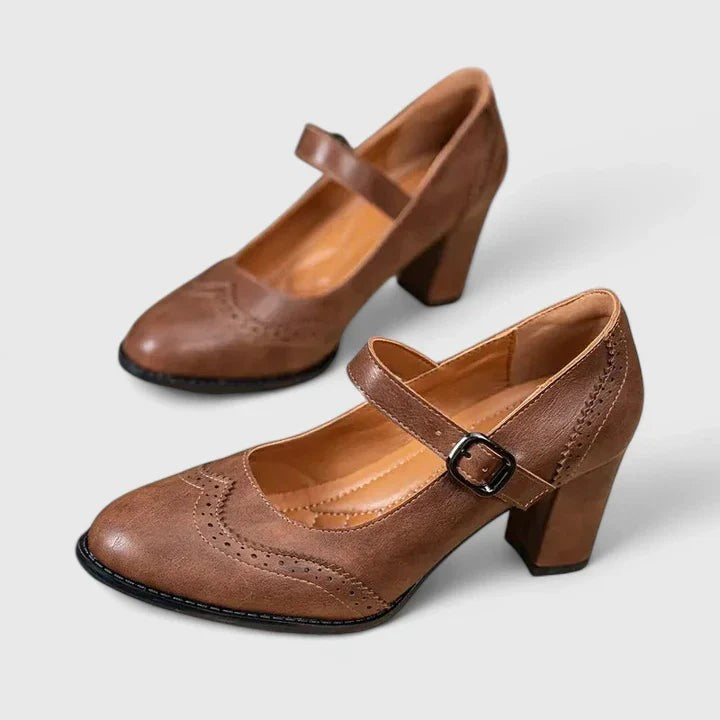 Brown leather Mary Jane block heel shoes with brogue detailing, side view