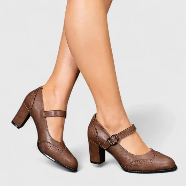 Brown leather Mary Jane block heel shoes with buckle strap on model