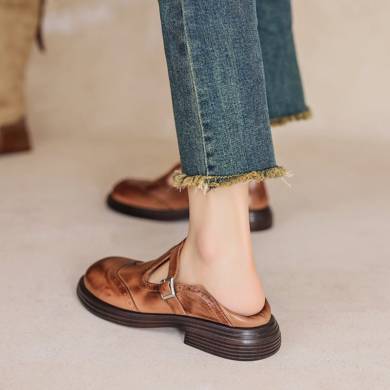 close-up of brown leather T-strap brogue shoe worn with cropped denim jeans
