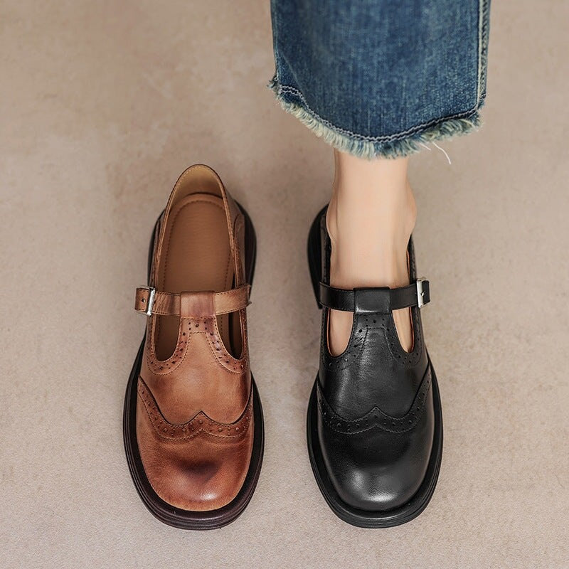 brown and black leather Mary Jane brogue shoes side by side with denim jeans