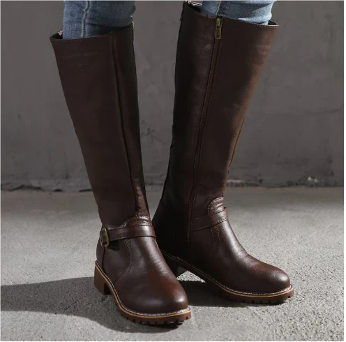 Dark brown knee-high leather boots featuring buckle detail and lug sole