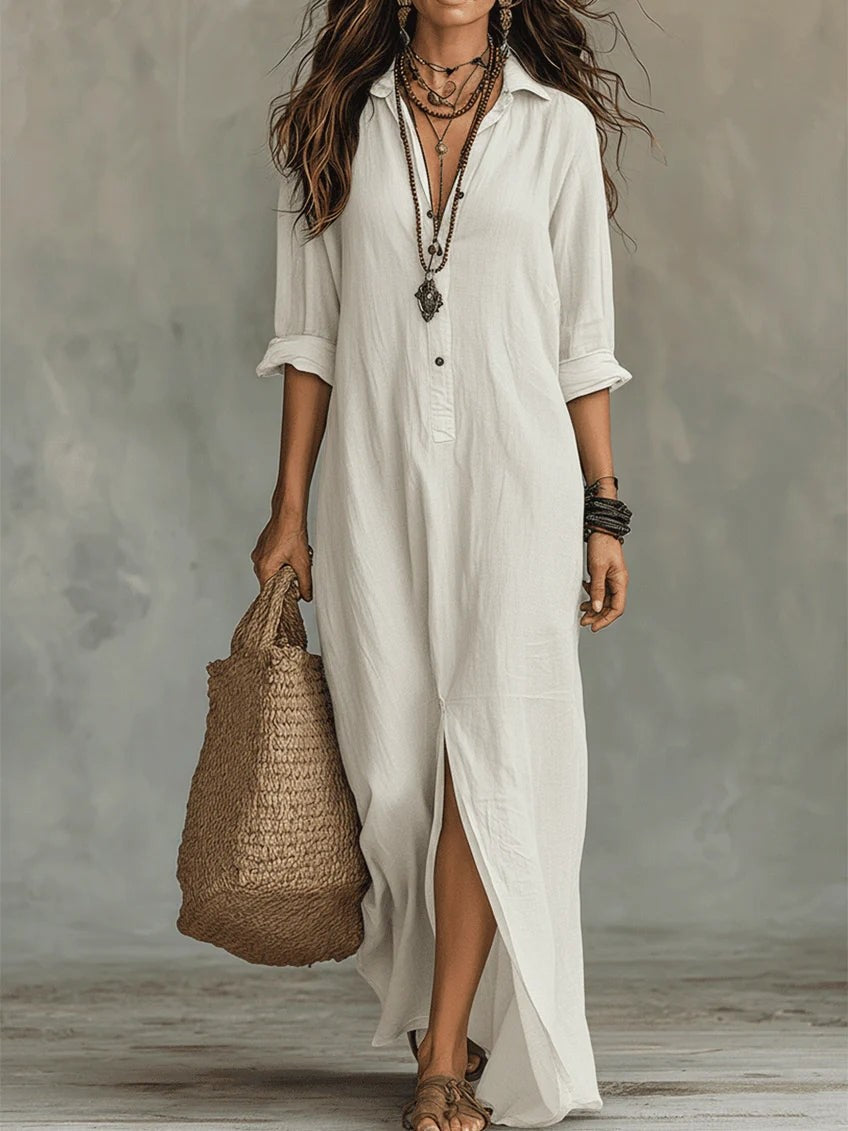 White long-sleeve button-front maxi shirt dress styled with a straw tote bag
