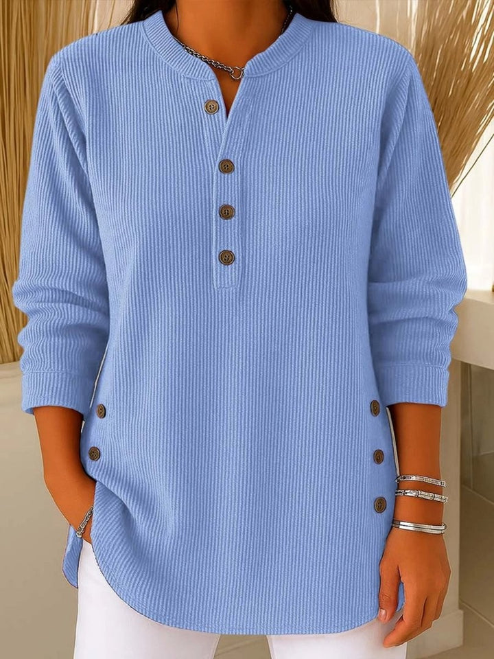 light blue ribbed knit henley top with button placket and side buttons