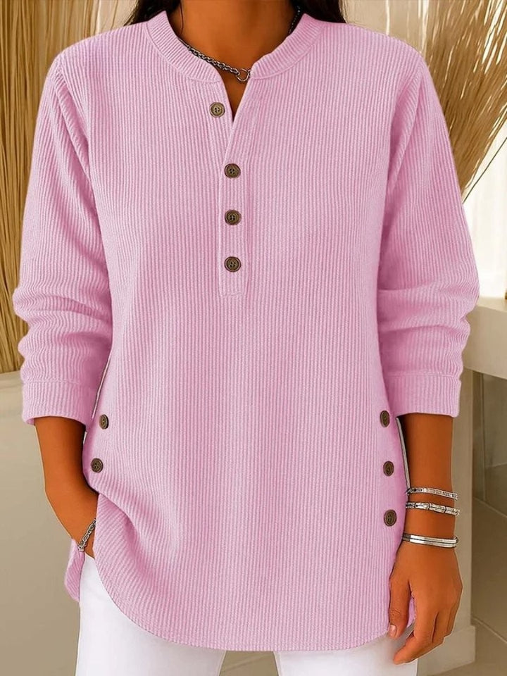 pink ribbed knit henley top with wooden buttons and long sleeves
