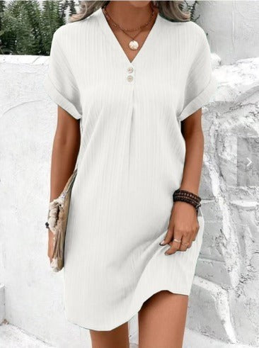 White ribbed V-neck mini dress featuring cuffed sleeves and curved hem