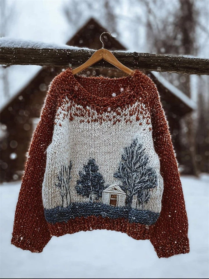 rust and cream sweater with knit winter cabin and pine tree scene