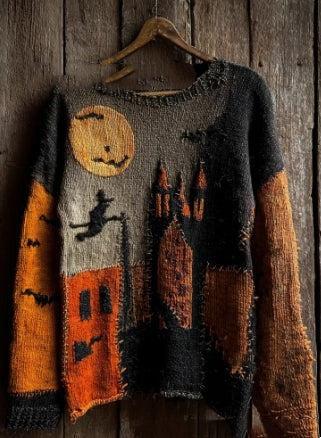 orange and black knit sweater featuring haunted castle and moon scene