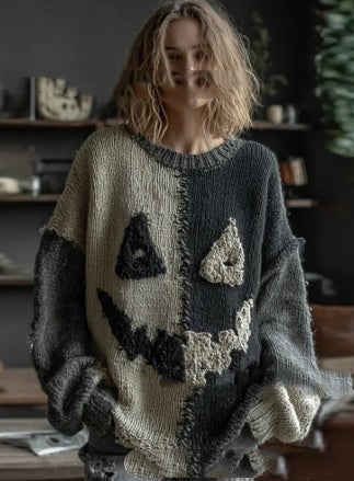 oversized gray sweater with knit jack-o-lantern face and distressed cuffs