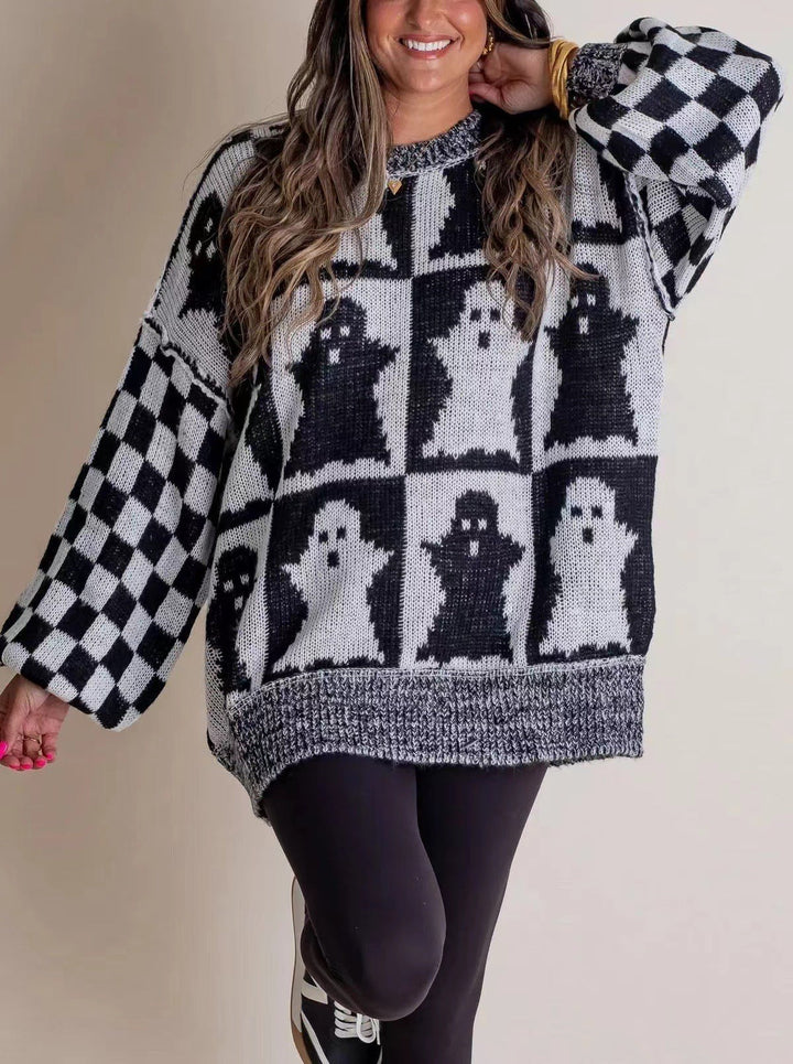 oversized black and white checkered sweater with ghost print Halloween design