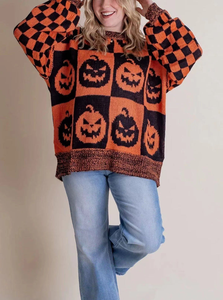 orange and black checkered sweater featuring jack-o-lantern pumpkin print