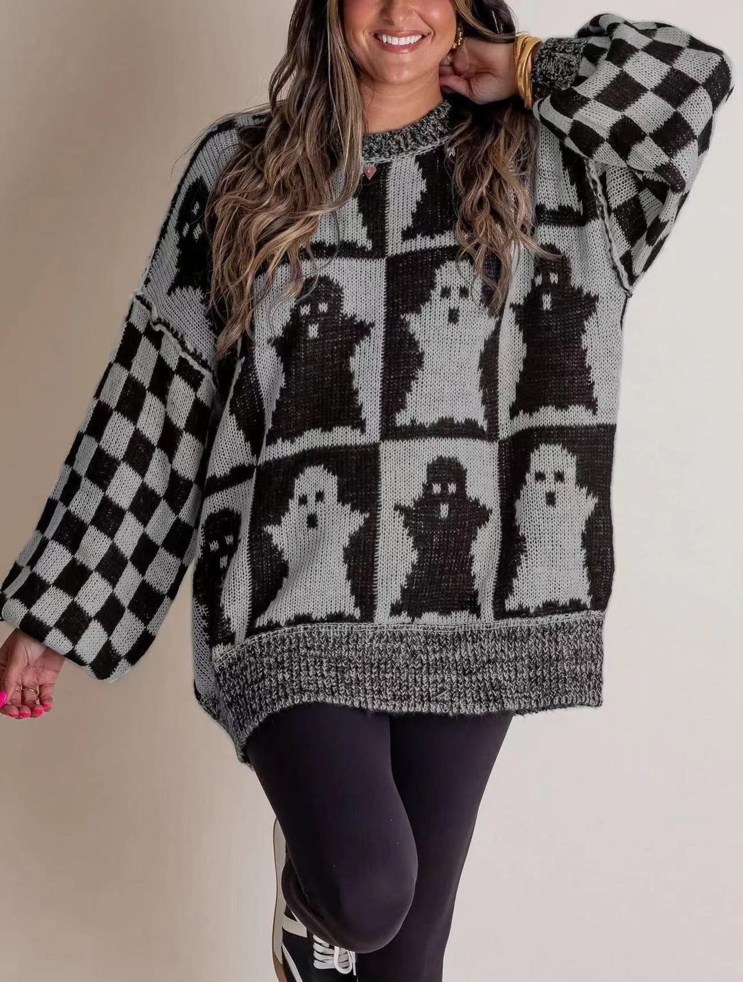gray and black checkered crew-neck sweater with knit ghost graphics