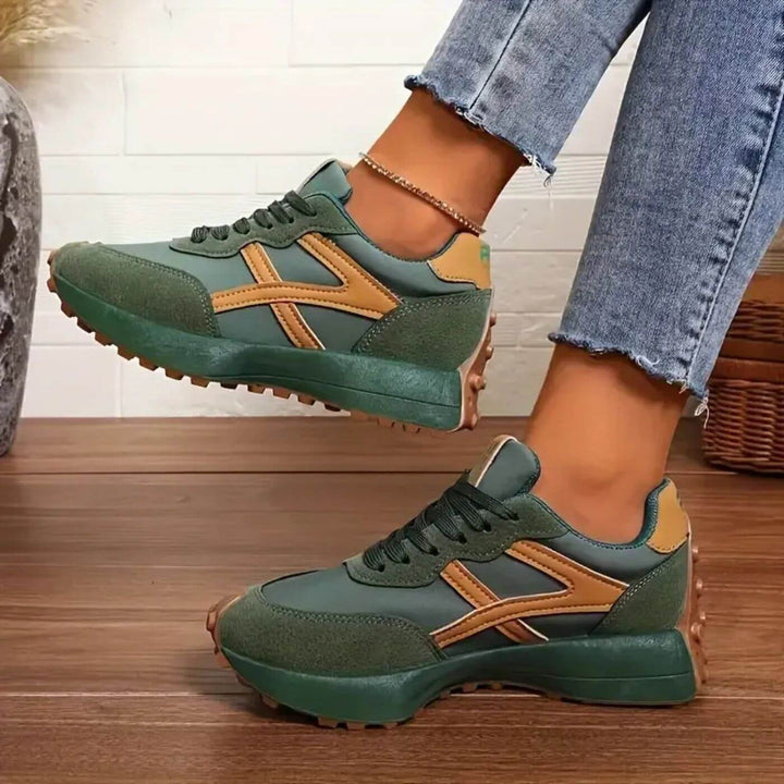 Green chunky sneakers with mustard stripe detail and rugged tread sole