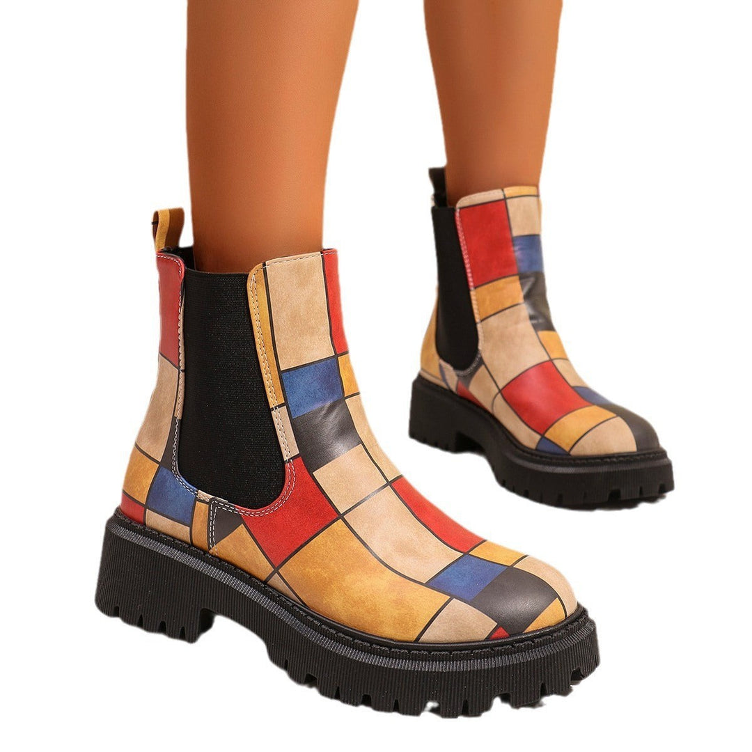 Multicolor patchwork Chelsea boots with mustard, red, and blue block design
