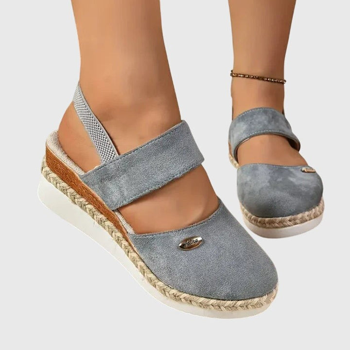 Light blue suede platform sandal with elastic ankle strap and espadrille sole