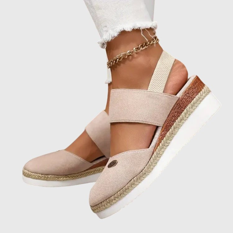 Beige espadrille wedge sandal with elastic ankle strap and layered platform sole