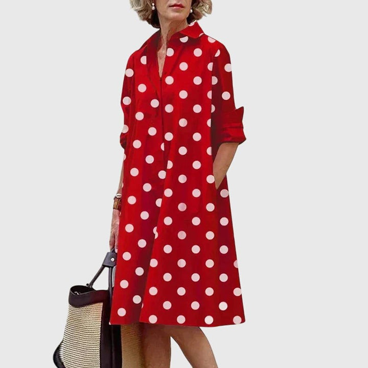 Red and white polka dot shirt dress with collared neckline and pockets