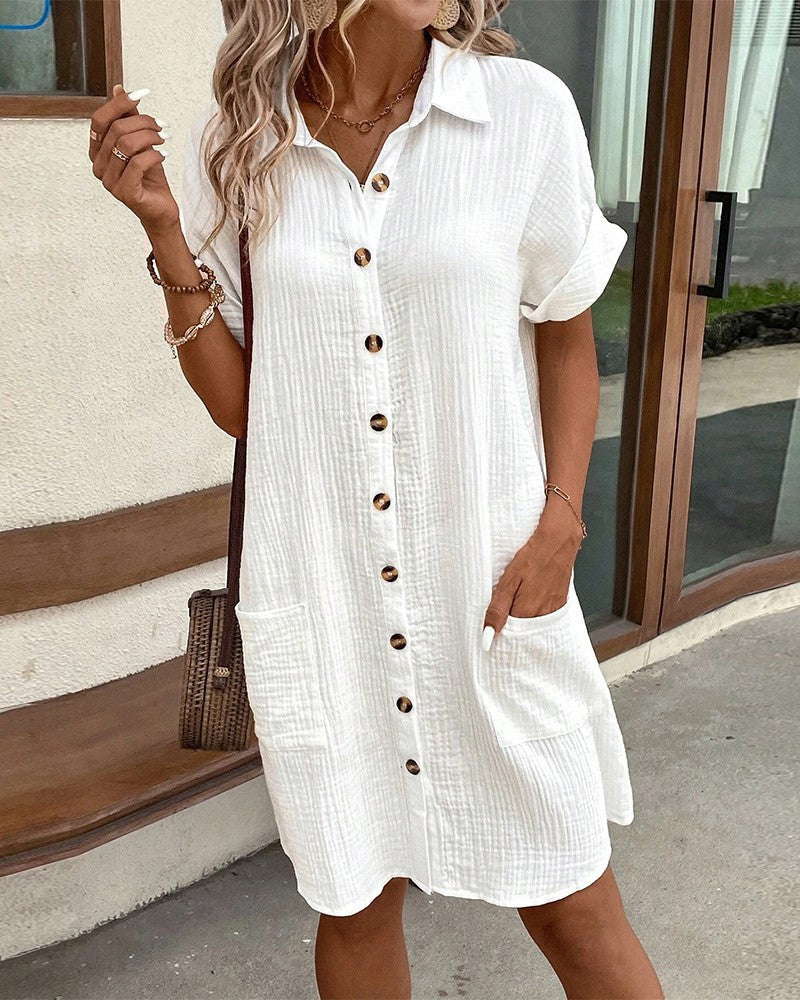 white textured shirt dress with tortoise buttons and patch pockets