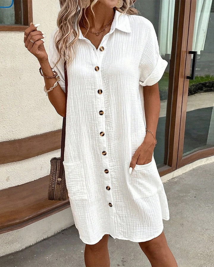 white textured shirt dress with tortoise buttons and patch pockets
