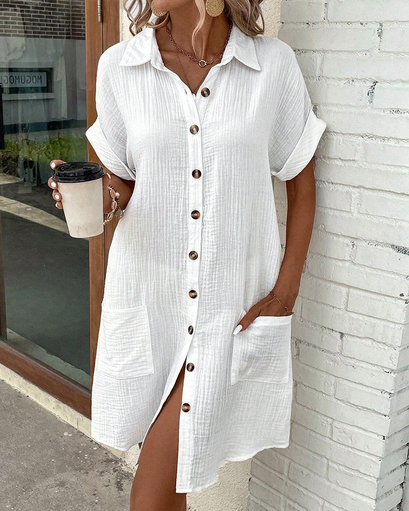 white collared shirt dress paired with woven straw crossbody bag