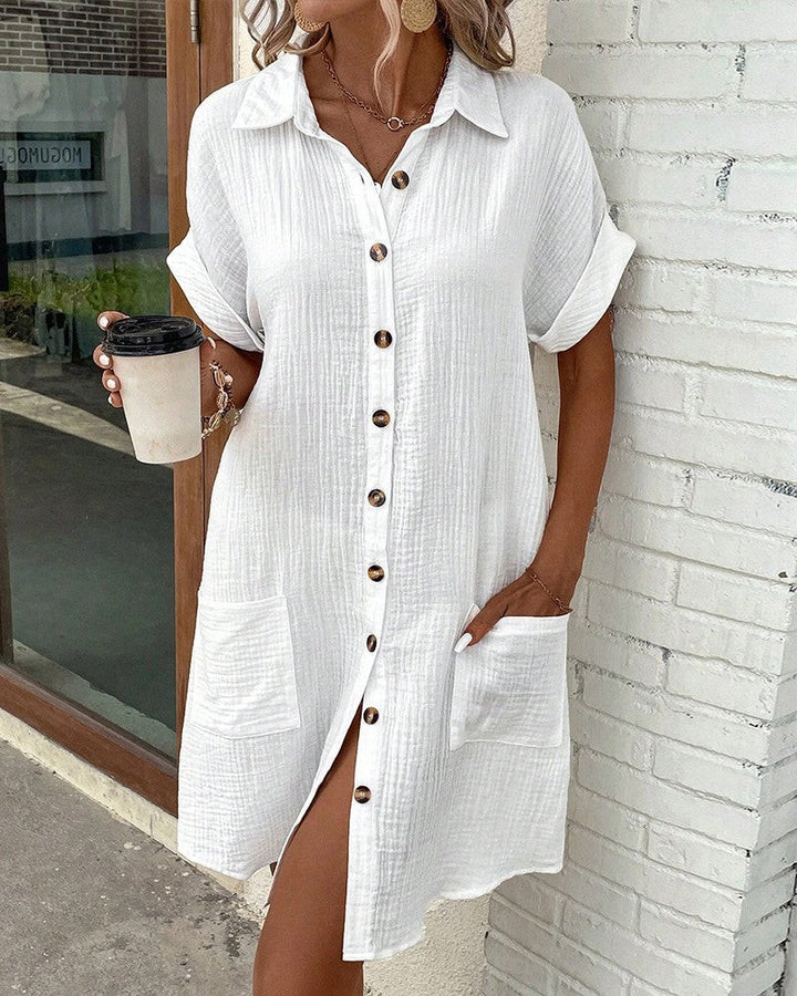 white collared shirt dress paired with woven straw crossbody bag