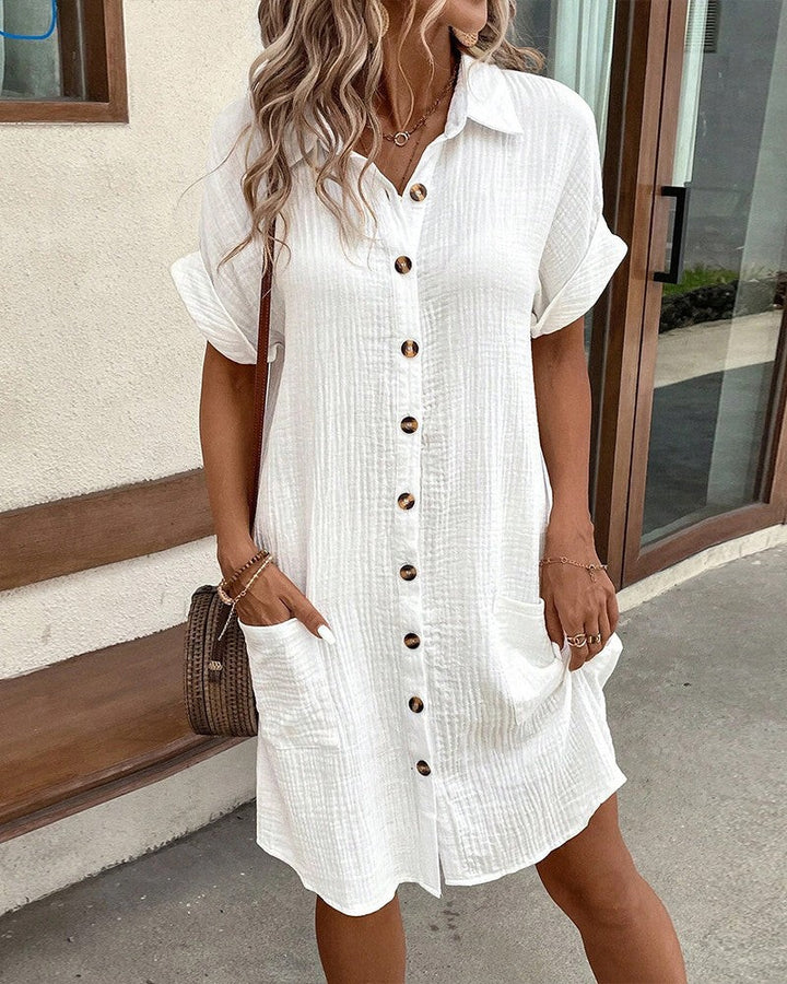 white button-down shirt dress with collared neckline and roomy pockets