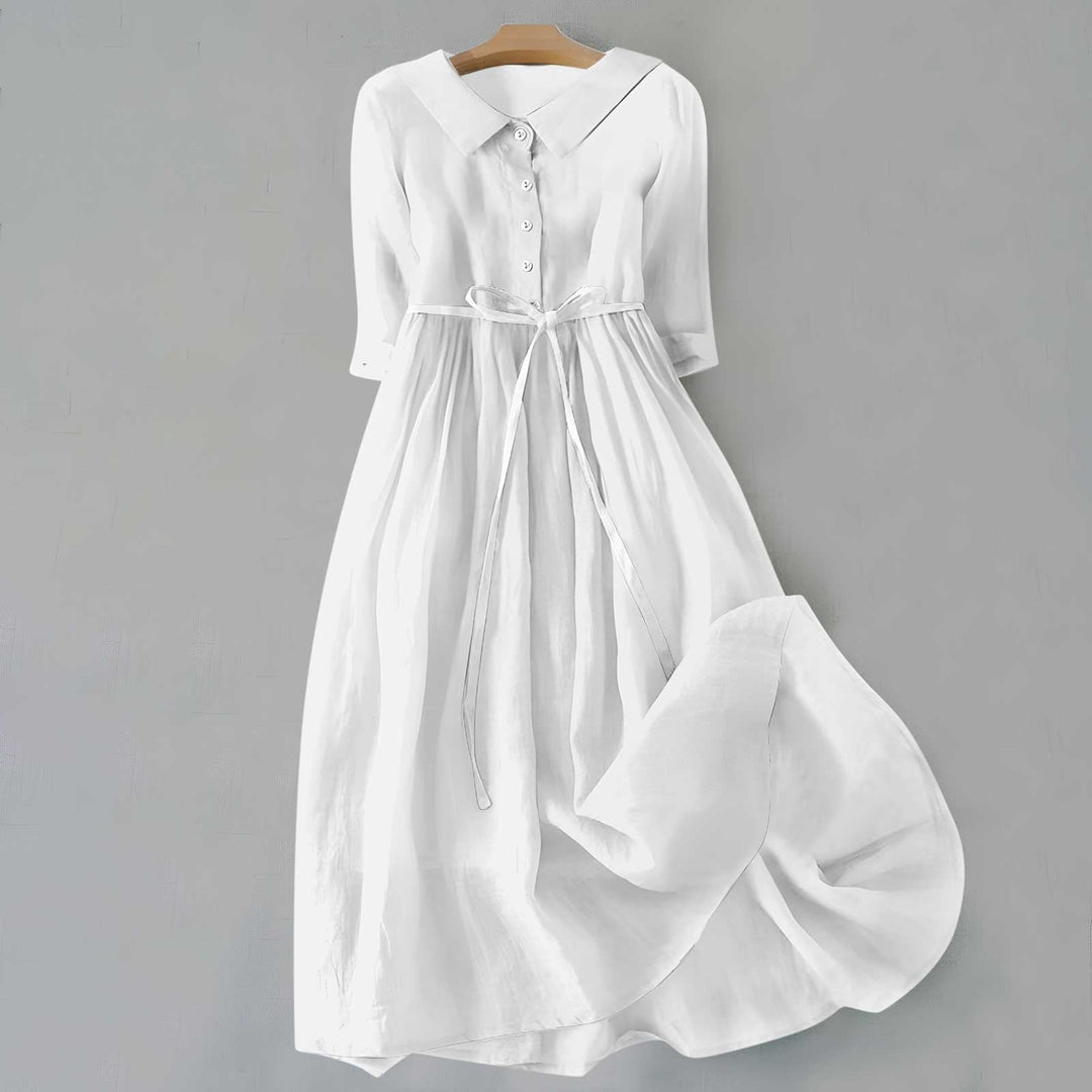 White linen shirt dress with collared neckline and half-length sleeves