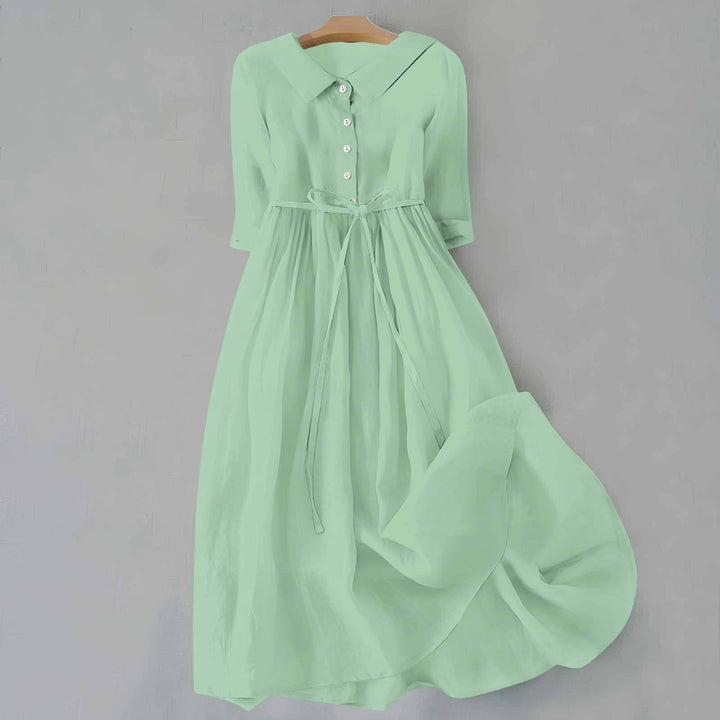Mint green linen midi dress featuring button front and waist tie