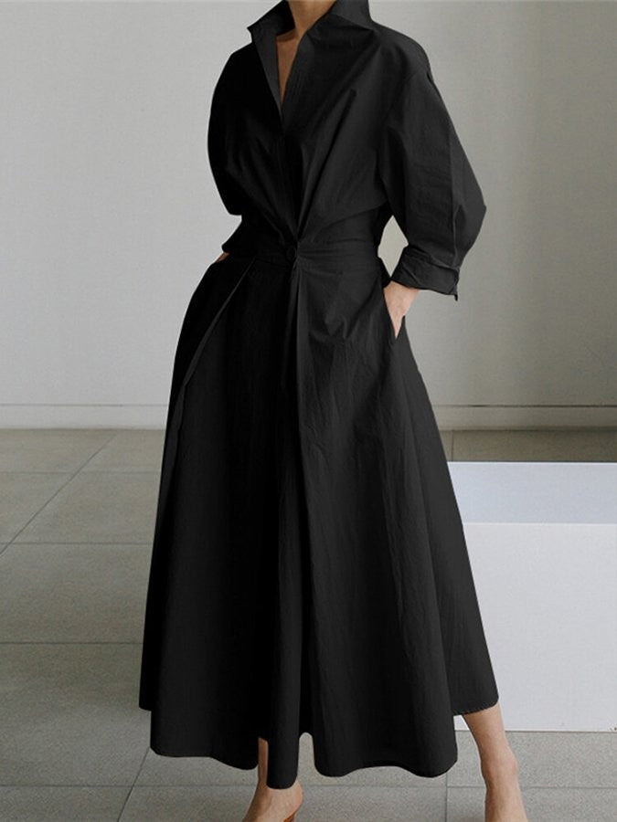 black collared maxi dress with cinched waist and voluminous pleated skirt