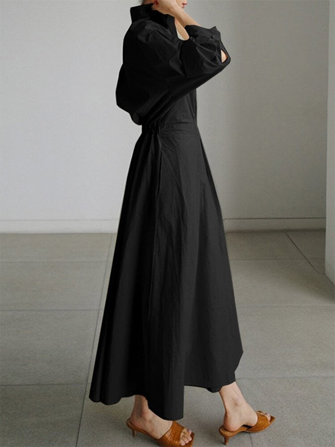 side profile of black maxi shirt dress with full A-line skirt