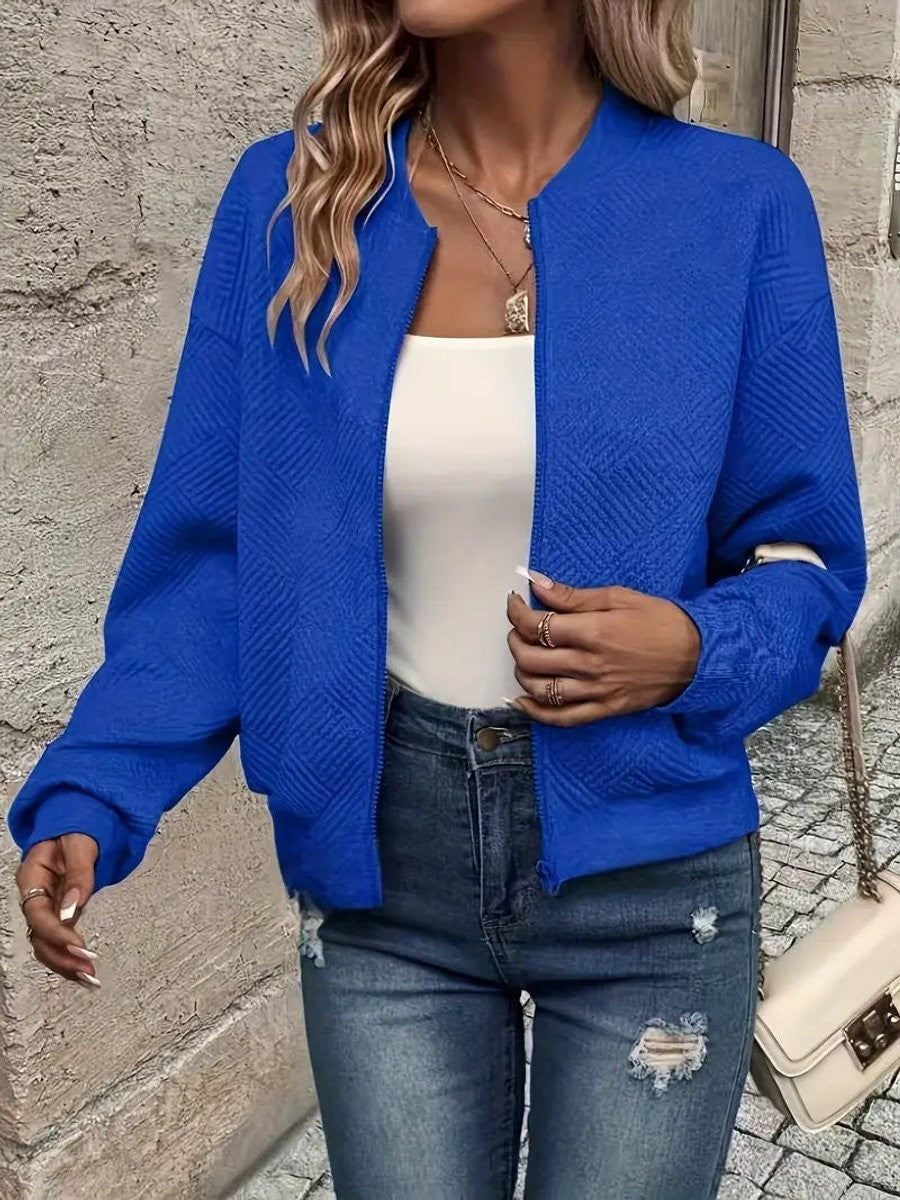 Cobalt blue zip-up bomber jacket featuring a subtle quilted pattern