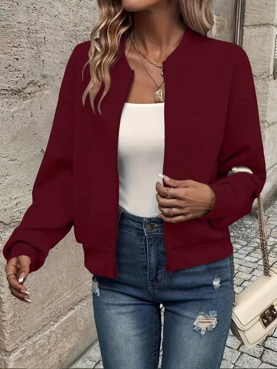 Burgundy cropped bomber jacket featuring diamond-textured fabric detailing