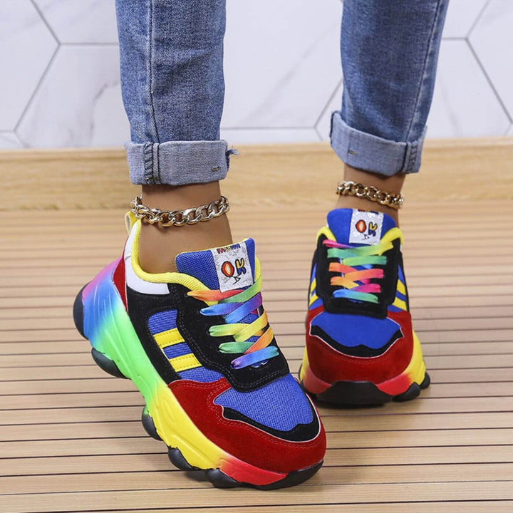 Rear view of red and blue chunky sneakers with rainbow midsole and gradient laces