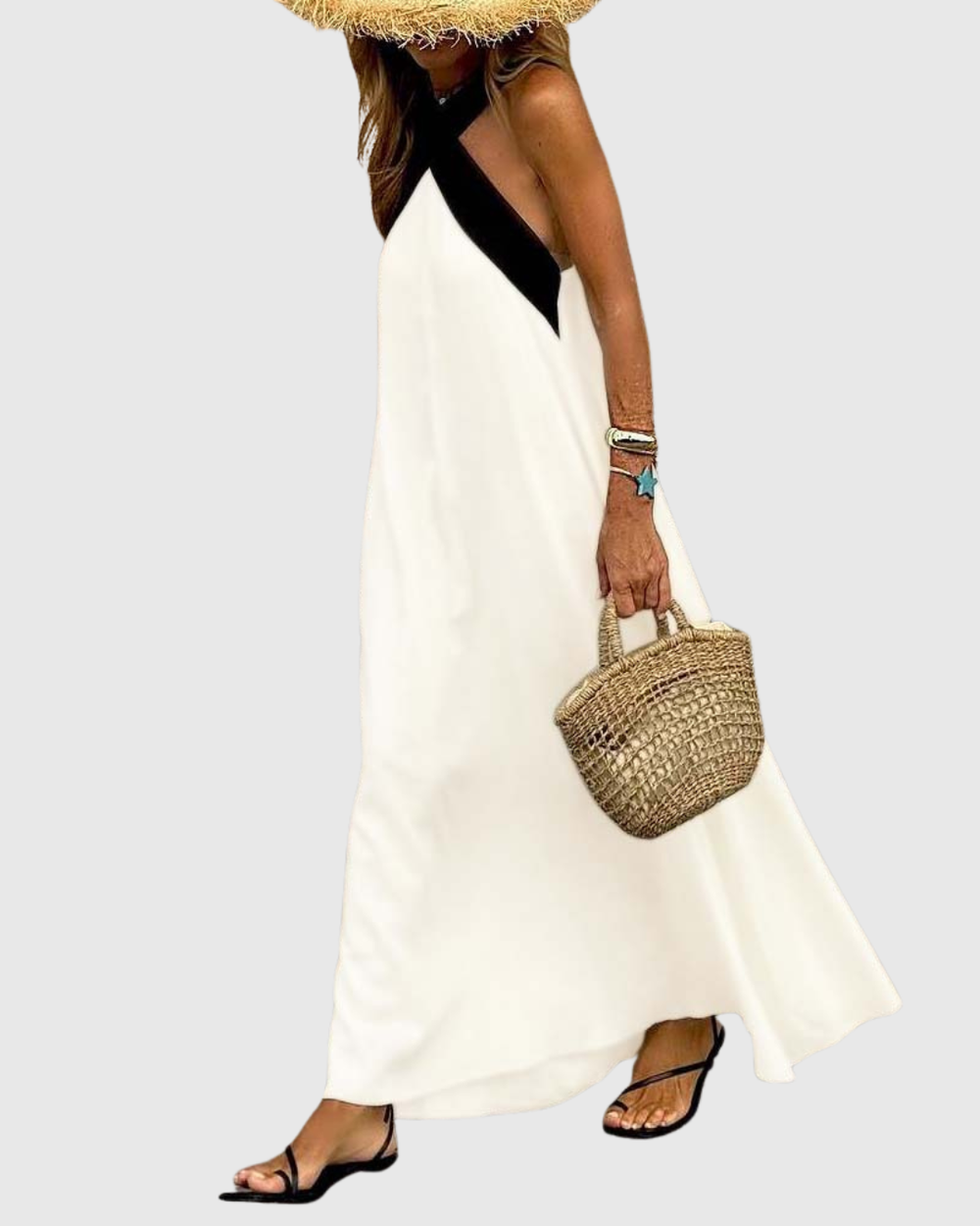 Side view of white halter maxi dress with black cross-neck detail