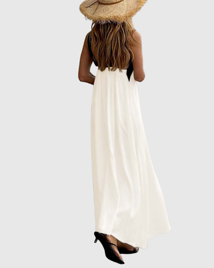Back view of white maxi dress with crisscross halter straps