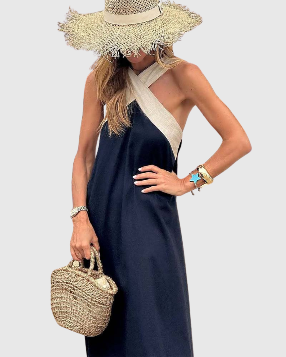 Side profile of navy maxi dress with beige crisscross halter straps